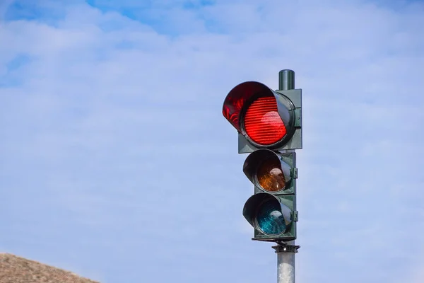 Red traffic light in the city street