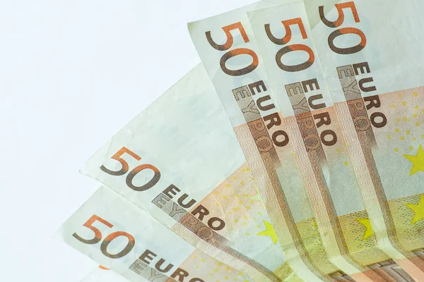 50 euro banknotes on white wooden background