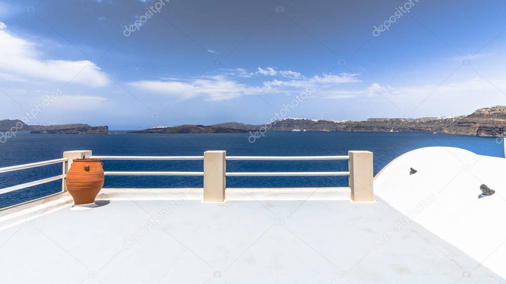 The large picturesque terrace on Santorini island offers views of the Aegean sea and the Caldera of an ancient volcano.
