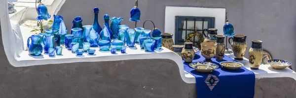 All Souvenirs in a small shop on the street of the city of Oia on the island of Santorini white and blue. These are the main colors of Greece.