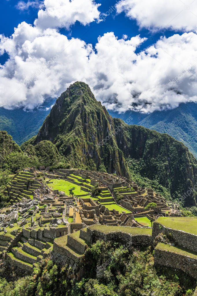 The ruins of the ancient Inca city of Machu Picchu are beautifully located on the slopes of the Andes over the turbulent waters of the Urubamba river.