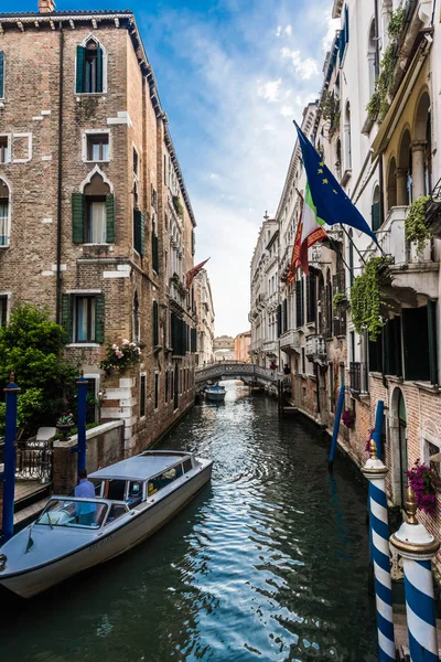 Old houses, washed by sea waters, stand along narrow canals in the heart of ancient Venice.