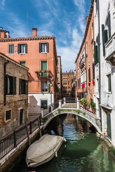 Old houses, washed by sea waters, stand along narrow canals in the heart of ancient Venice.