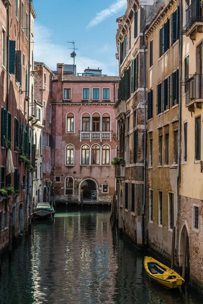 Old houses, washed by sea waters, stand along narrow canals in the heart of ancient Venice.