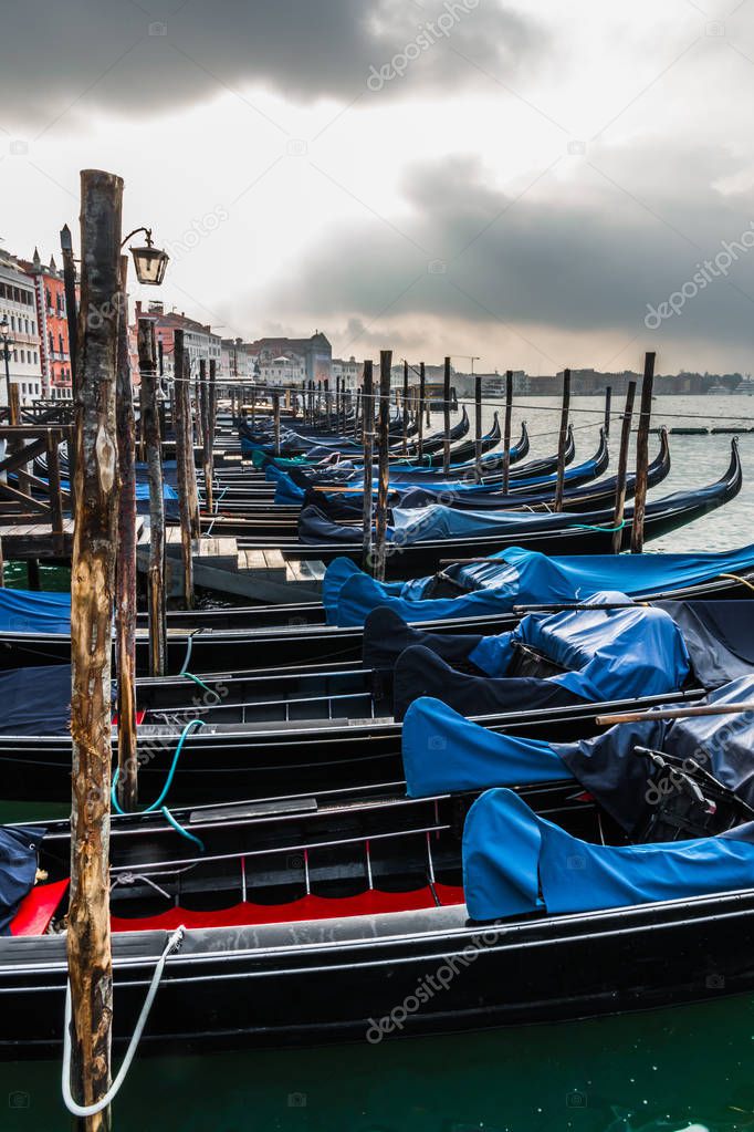 In the early morning you can enjoy a picturesque view of the Venetian gondolas at the pier on the waterfront and the island of San Giorgio Maggiore.