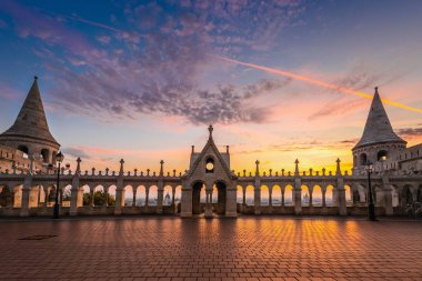 Budapest, Hungary - Beautiful golden sunrise at Fisherman's Bastion with Parliament of Hungary and St. Stephen's Basilica at background with colourful sky and clouds clipart