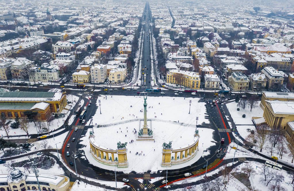 Budapest, Hungary - Aerial skyline view of snowy Budapest with Heroes' Square, Andrassy street and ice rink on a cold winter day