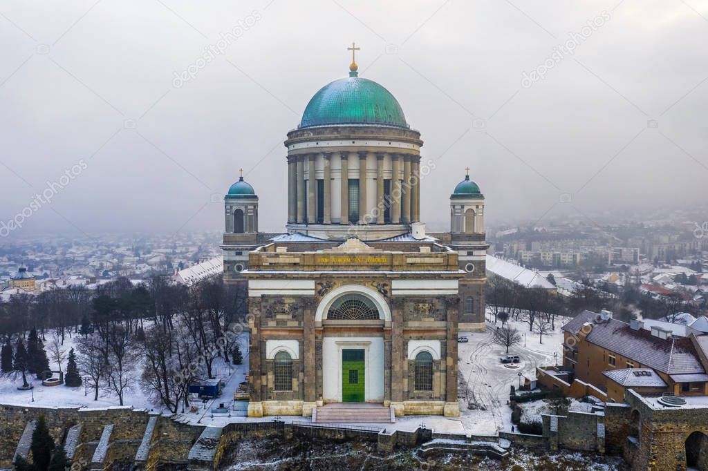 Esztergom, Hungary - Aerial view of the beautiful snowy Basilica of Esztergom on a foggy winter morning