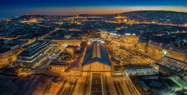 Budapest, Hungary - Aerial panoramic skyline view of Budapest at dusk with illuminated Western Railway Station, Parliament, St. Stephen\'s Basilica, Buda Castle Royal Palace and Fisherman\'s Bastion
