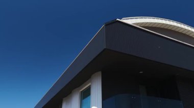 Sleek, newly constructed residential buildings with clear facades.