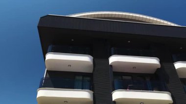 Residential complex featuring modern architecture by the coast.