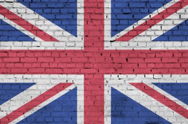 Great britain flag is painted onto an old brick wall clipart