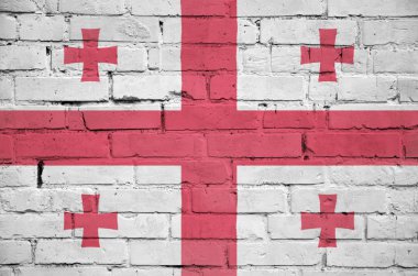 Georgia bayrağı eski bir tuğla duvara boyanmış.