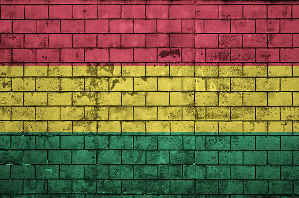 Bolivia flag is painted onto an old brick wall