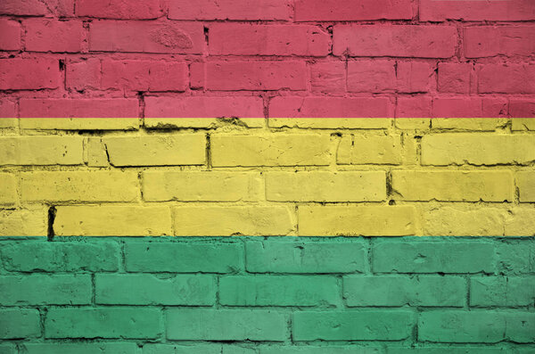 Bolivia flag is painted onto an old brick wall