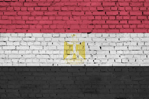 Egypt flag is painted onto an old brick wall
