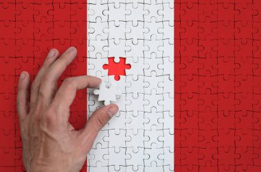 Peru bayrağı yukarı doğru elini tamamlar bir bulmaca, tasvir.