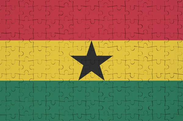 加纳国旗描绘在一个折叠的拼图上 — 图库照片