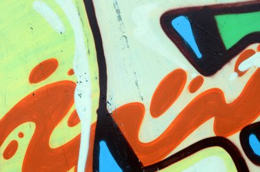 Sokak sanatı. Haki yeşil ve turuncu tonlarında renkli grafiti resmi bir parçasının arka plan görüntü.