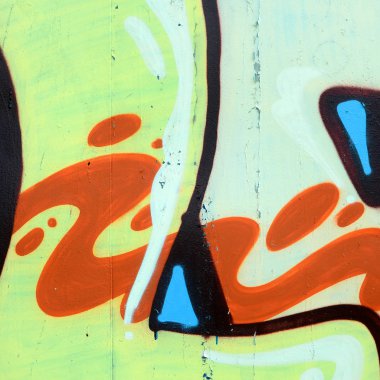 Sokak sanatı. Haki yeşil ve turuncu tonlarında renkli grafiti resmi bir parçasının arka plan görüntü.