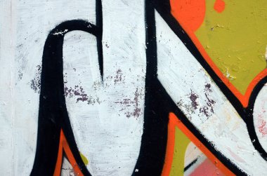 Sokak sanatı. Beyaz ve turuncu tonlarında renkli grafiti resmi bir parçasının arka plan görüntü.
