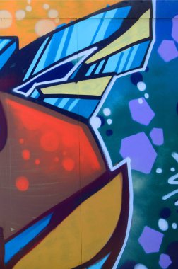 Sokak sanatı. Bej ve turuncu tonlarında renkli grafiti resmi bir parçasının arka plan görüntü.