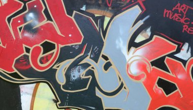 Sokak sanatı. Koyu gri ve kırmızı tonları tam tamamlanan grafiti resimde arka plan görüntü.