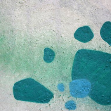 Sokak sanatı. Haki yeşil ve turuncu tonlarında renkli grafiti resmi bir parçasının arka plan görüntü.