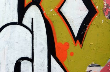 Sokak sanatı. Beyaz ve turuncu tonlarında renkli grafiti resmi bir parçasının arka plan görüntü.