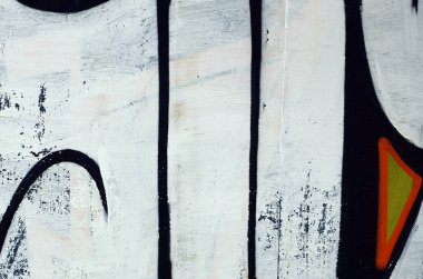 Sokak sanatı. Beyaz ve turuncu tonlarında renkli grafiti resmi bir parçasının arka plan görüntü.