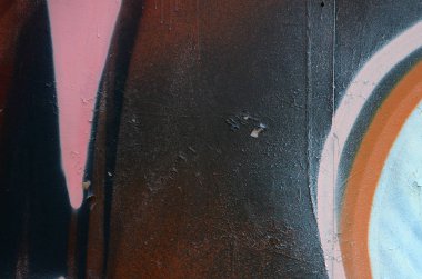 Sokak sanatı. Beyaz ve turuncu tonlarında renkli grafiti resmi bir parçasının arka plan görüntü.