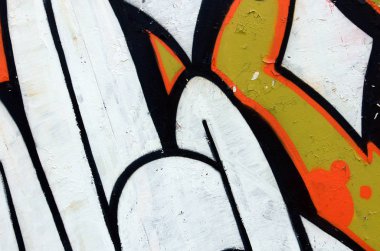 Sokak sanatı. Beyaz ve turuncu tonlarında renkli grafiti resmi bir parçasının arka plan görüntü.
