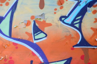 Sokak sanatı. Bej ve turuncu tonlarında renkli grafiti resmi bir parçasının arka plan görüntü.
