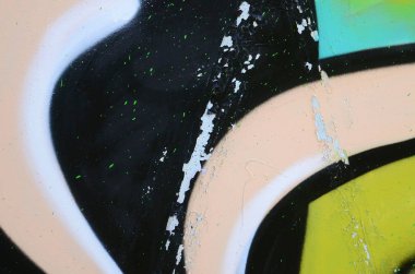 Sokak sanatı. Haki yeşil ve turuncu tonlarında renkli grafiti resmi bir parçasının arka plan görüntü.