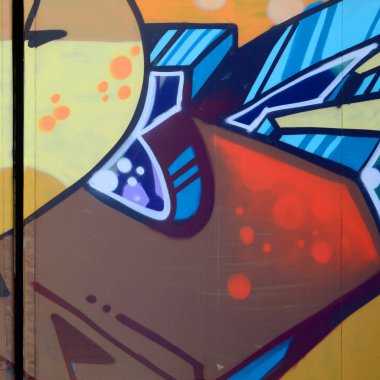 Sokak sanatı. Bej ve turuncu tonlarında renkli grafiti resmi bir parçasının arka plan görüntü.