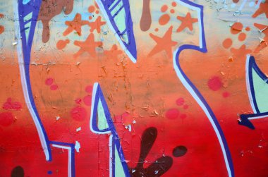 Sokak sanatı. Bej ve turuncu tonlarında renkli grafiti resmi bir parçasının arka plan görüntü.