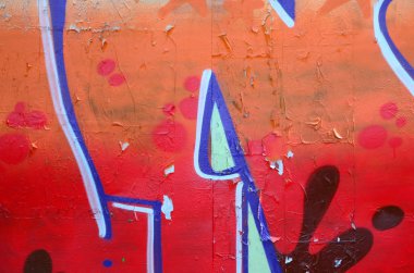 Sokak sanatı. Bej ve turuncu tonlarında renkli grafiti resmi bir parçasının arka plan görüntü.