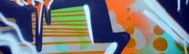 Street art. Abstract background image of a fragment of a colored graffiti painting in khaki green and orange tones. clipart