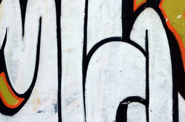 Sokak sanatı. Beyaz ve turuncu tonlarında renkli grafiti resmi bir parçasının arka plan görüntü.