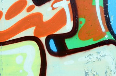 Sokak sanatı. Haki yeşil ve turuncu tonlarında renkli grafiti resmi bir parçasının arka plan görüntü.