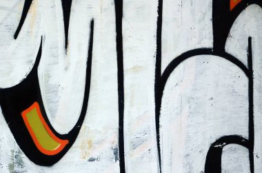 Sokak sanatı. Beyaz ve turuncu tonlarında renkli grafiti resmi bir parçasının arka plan görüntü.