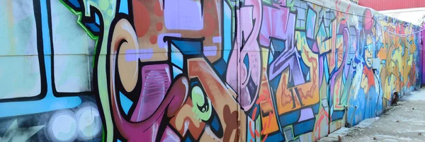 Street art. Abstract background image of a full completed graffiti painting in many fashionable colors and tones.