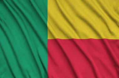 Benin flag  is depicted on a sports cloth fabric with many folds. Sport team waving banner