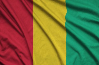 Gine bayrağı ile birçok çiziklere spor bez kumaş üzerinde tasvir edilmiştir. Spor takım sallayarak afiş