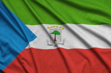 Ekvator Ginesi bayrağı ile birçok çiziklere spor bez kumaş üzerinde tasvir edilmiştir. Spor takım sallayarak afiş