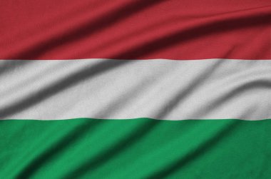 Macaristan bayrağı ile birçok çiziklere spor bez kumaş üzerinde tasvir edilmiştir. Spor takım sallayarak afiş