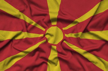 Makedonya bayrağı ile birçok çiziklere spor bez kumaş üzerinde tasvir edilmiştir. Spor takım sallayarak afiş