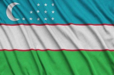 Özbekistan bayrağı ile birçok çiziklere spor bez kumaş üzerinde tasvir edilmiştir. Spor takım sallayarak afiş