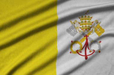 Vatikan Devlet bayrağı ile birçok çiziklere spor bez kumaş üzerinde tasvir edilmiştir. Spor takım sallayarak afiş