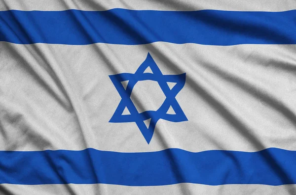 以色列国旗在运动布织物上描绘了许多褶皱 运动队挥舞旗帜 — 图库照片